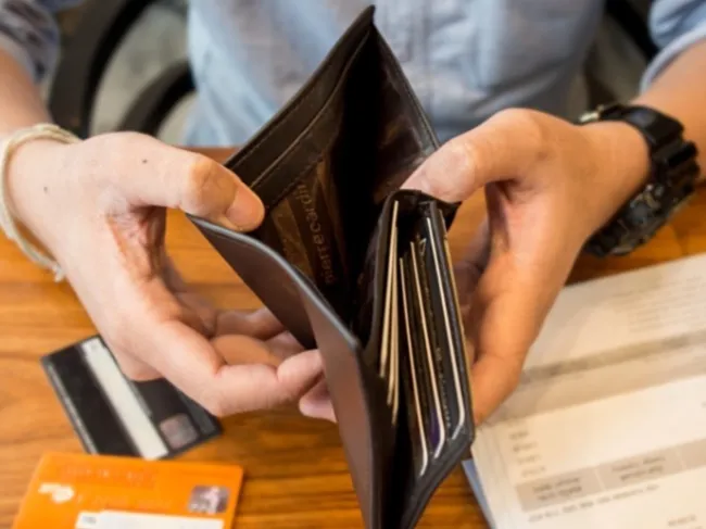 man holding empty wallet